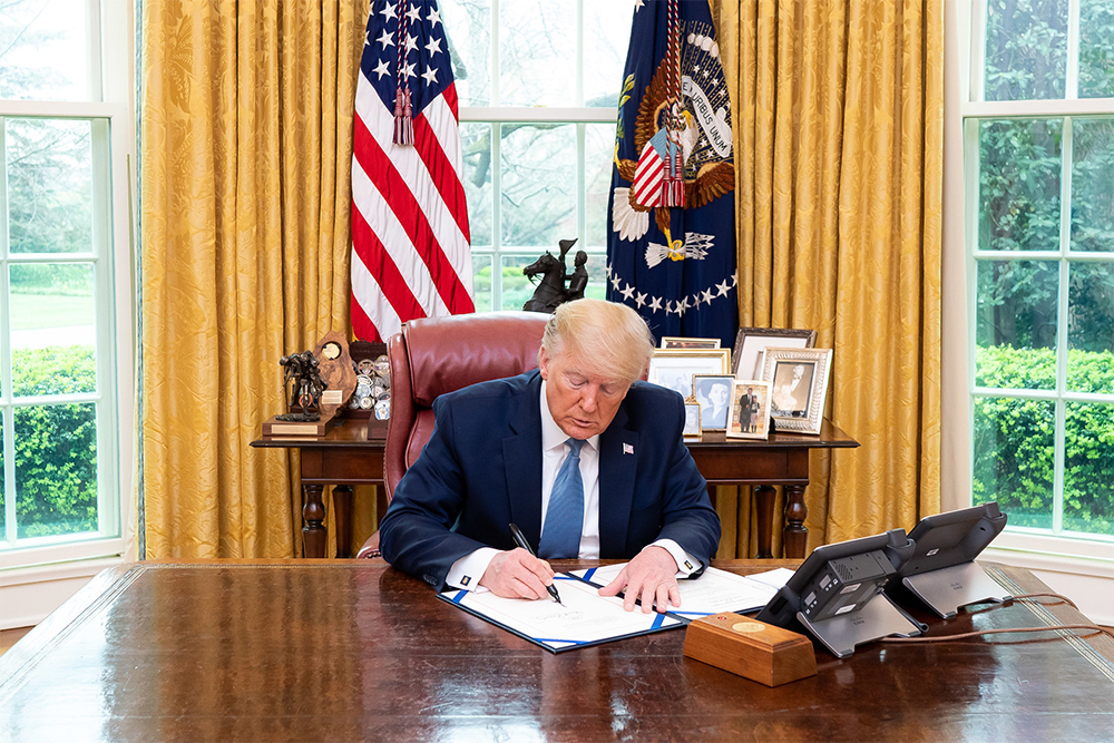 President Donald J. Trump in the Oval Office of the White House, 21 March 2020 (Official White House Photo by Tia Dufour)